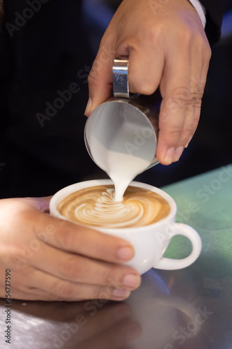 How to pour milk into hot coffee
