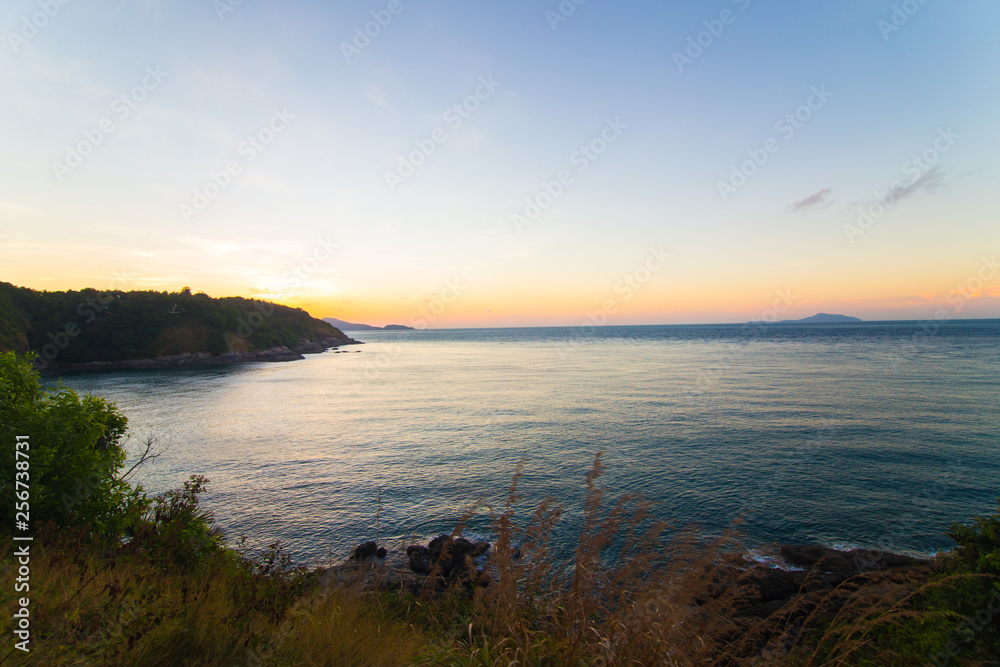 Obraz premium Sea coastline sunset island with colourful sky cloud