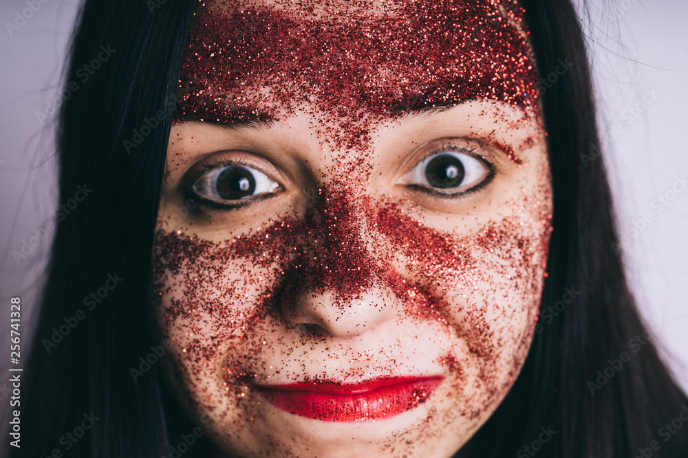Crazy girl, face close-up. Bizarre portrait with painted face Crazy girl, face close-up. Bizarre portrait with painted face