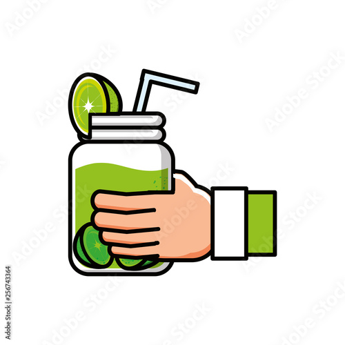 hand with delicious and fresh lemonade