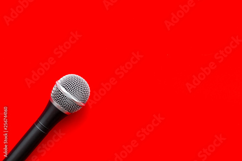 podcast record with microphone on red background top view space for text