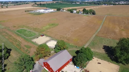 Aerial view of a corn field and a red farmhouse in Lancaster County, Pennsylvania. photo