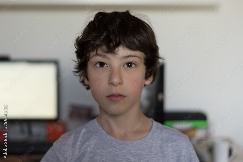 Portrait of a boy in the household environment of the apartment. Portrait of a boy in the household environment of the apartment.
