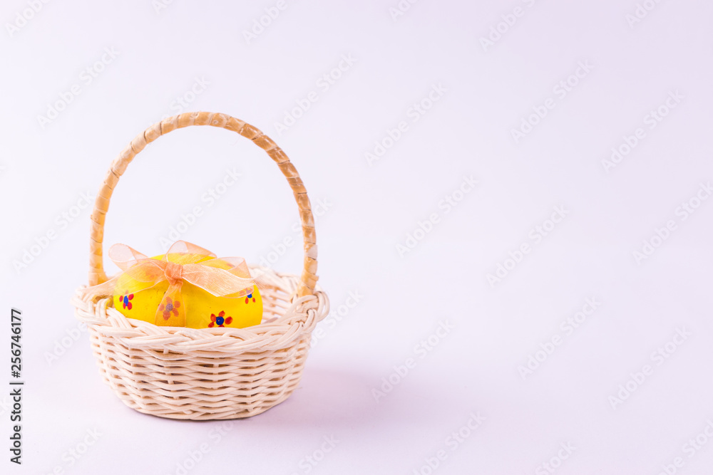 Happy Easter. Easter eggs concept. Closeup Easter eggs in the basket on white paper background.