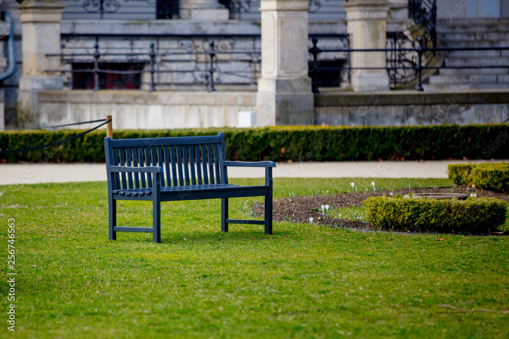 Bench in French style in a park. Bench in French style in a park.