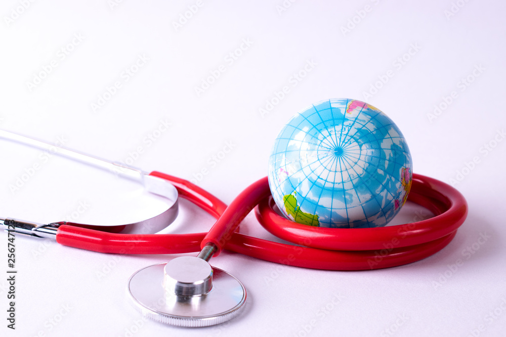 World health day, Healthcare and medical concept. Stethoscope wrapped around globe on white background. World health day, Healthcare and medical concept. Stethoscope wrapped around globe on white background.