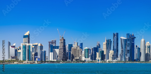 The morning panoramic view of the skyscrapers of Doha from the Persian Gulf. Futuristic skyline in the financial district of Qatar © sonatalitravel
