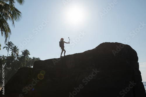Woman Hiker taking selfie with Action Camera