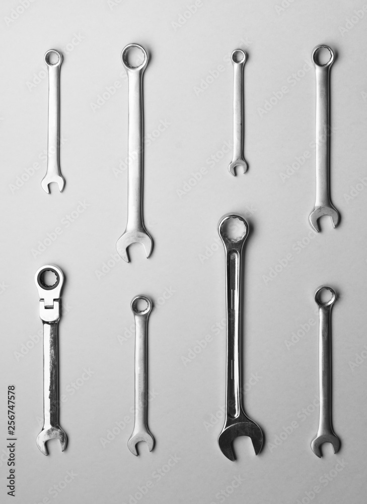 A few wrenches on a gray background. A few wrenches on a gray background.