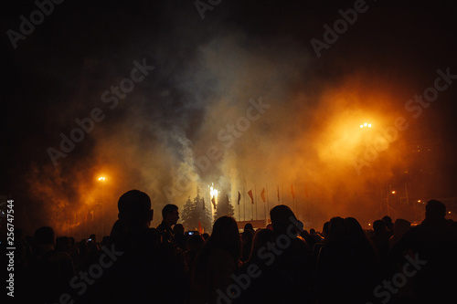Silhouettes of crowds of people who are watching the fireworks. Celebrate the holiday in the square. great fun © etonastenka