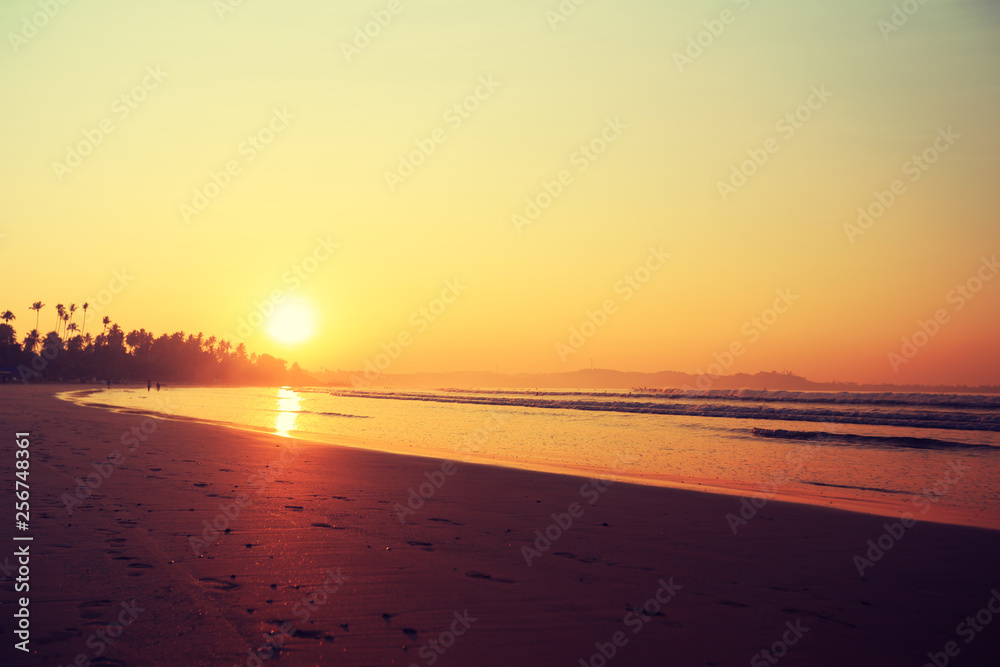 Beautiful tropical beach in the sunrise