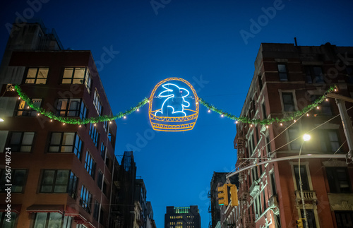 Neon eastern rabbit at night on the street in Little Italy district, New York