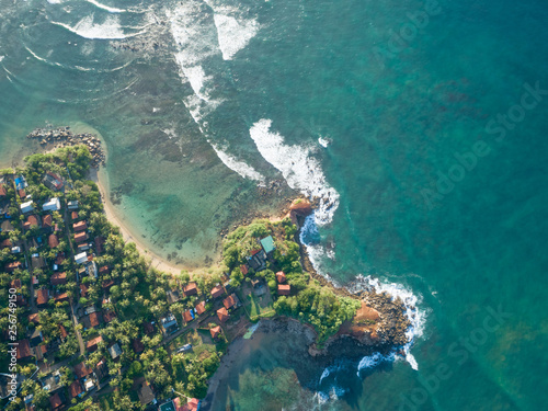 Aerial view of beautiful seascape with fisherman village in sri lanka