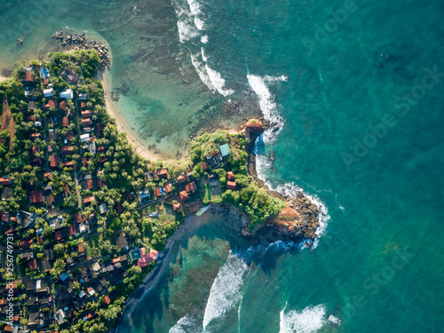 Aerial view of beautiful seascape with fishermen village in sri lanka