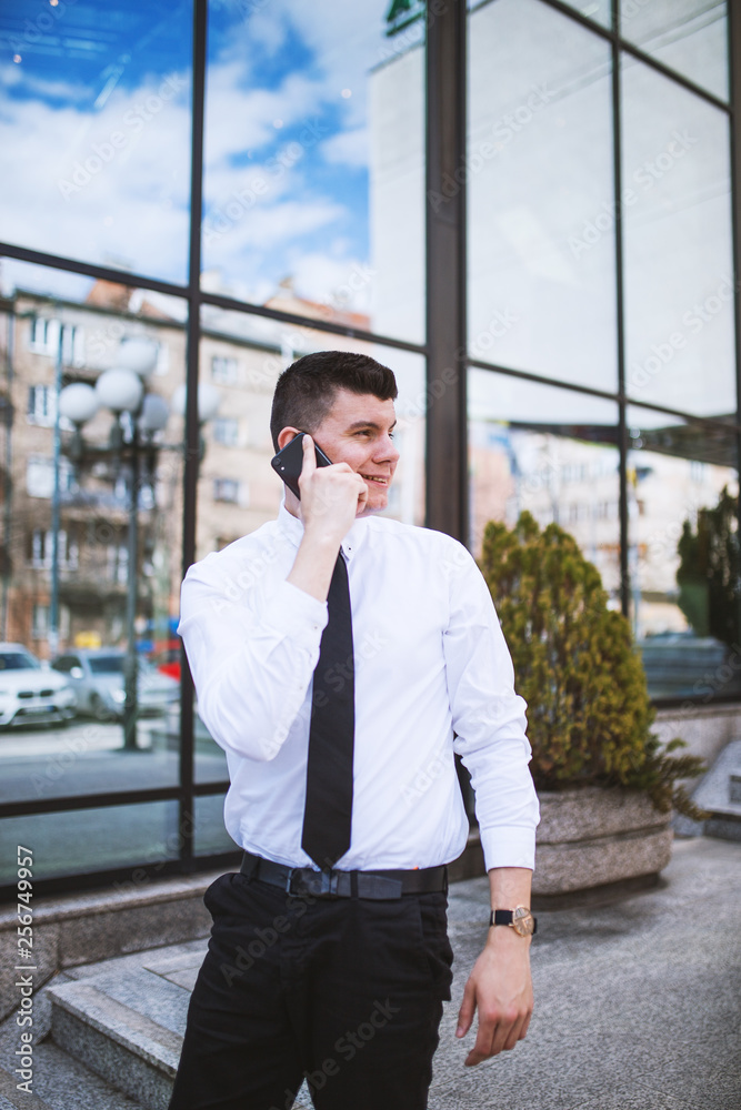 Fototapeta premium Smart businessman well dressed talking on the phone