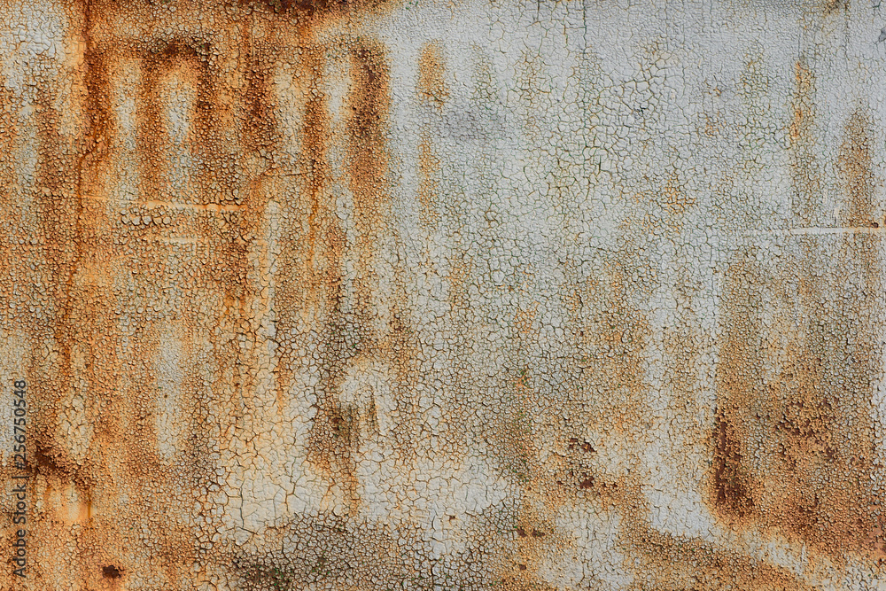 Old iron wall covered with grey paint. Abstract background.