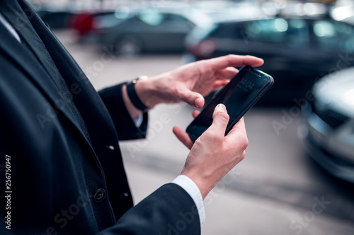 Businessman using smartphone close up