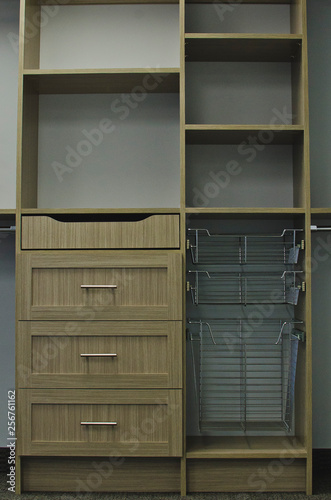 The front view of the gray style closet organizer and shelf.