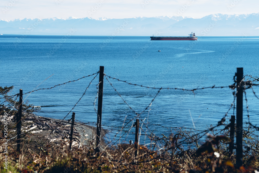 cargo ship with the barb wire foreground