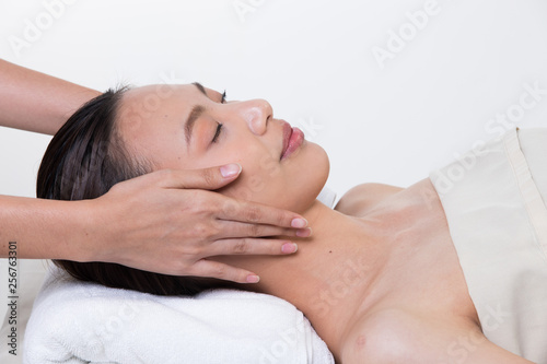 Ayurvedic Head Massage Therapy on facial forehead Master Chakra Point of Asian woman, Therapist Spa body woman hands treatment on customer to increase circulation release tension stress of think work