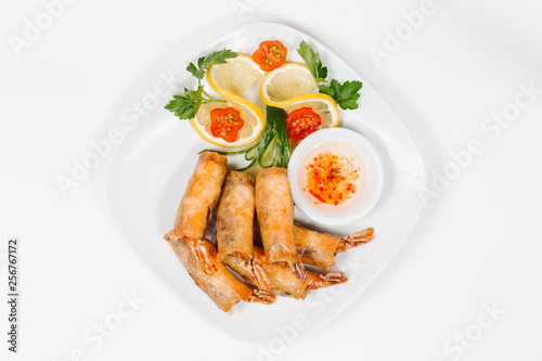 Traditional oriental cuisine of Vietnam. Pancakes with shrimps on a white background