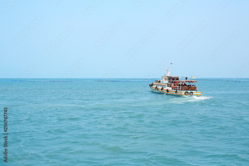 The Transportation boat with people on the sea.