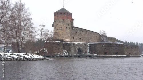 Olavinlinna fortress close-up on a cloudy March day. Savonlinna, Finland photo