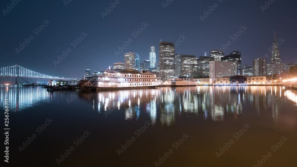 San Francisco Skyline and Bay Bridge Reflections on Ocean at Pier 7 San Francisco Skyline and Bay Bridge Reflections on Ocean at Pier 7