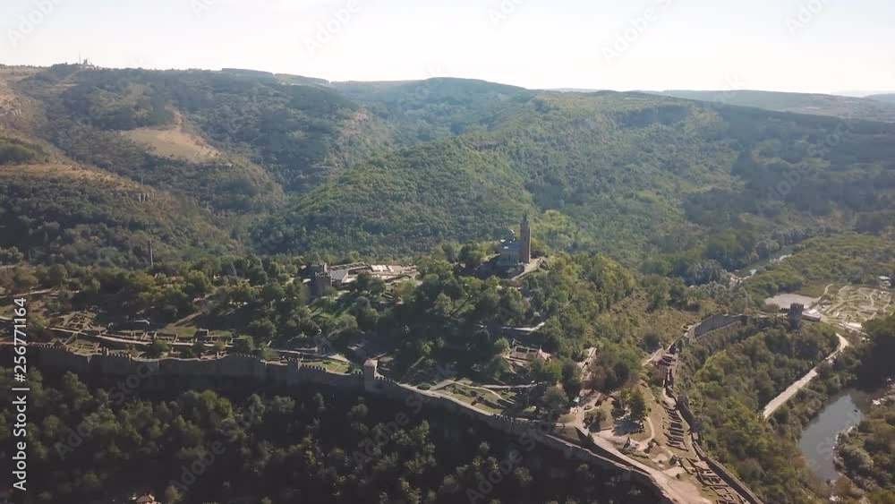 Forward, crane down drone shot over a hill with an archeological site in Bulgaria. 4k video quality Forward, crane down drone shot over a hill with an archeological site in Bulgaria. 4k video quality