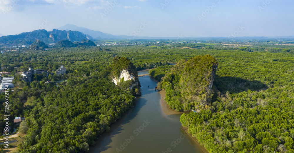 View from above, stunning aerial view of Khao Khanap Nam in Krabi town, Thailand. Khao Khanap Nam are two 100-meters tall limestone mountains jutting out of the Krabi River.