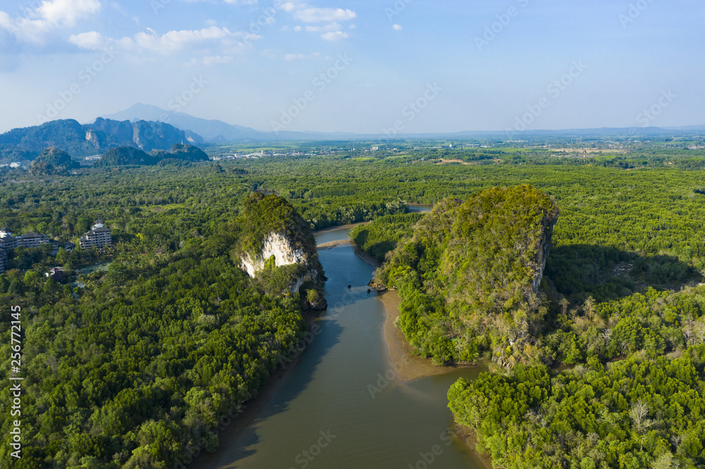 Obraz premium View from above, stunning aerial view of Khao Khanap Nam in Krabi town, Thailand. Khao Khanap Nam are two 100-meters tall limestone mountains jutting out of the Krabi River.
