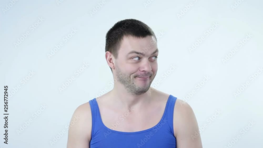 Young man expression shows emotions in front of the camera. Young man expression shows emotions in front of the camera.