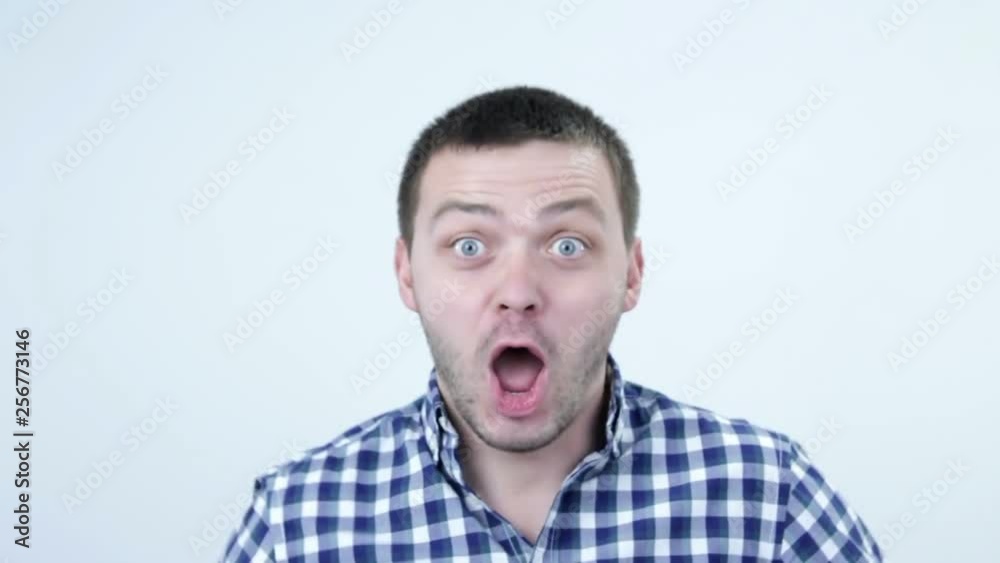 Man laughing at you. Portrait of a male person in focus pointing finger towards the camera. Man laughing at you. Portrait of a male person in focus pointing finger towards the camera.