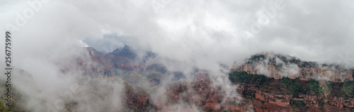 Large panoramic view on Grand Canyon under heavy fog