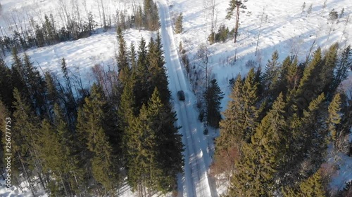 Car driving on a winter road in Trysil, Norway. photo