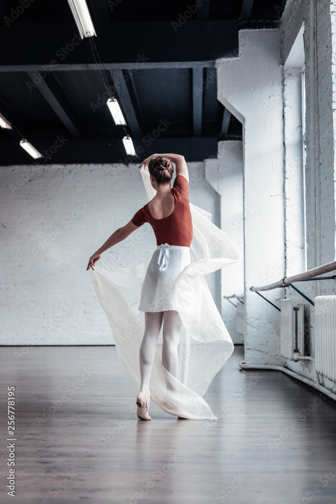 Beautiful attractive dancer holding a piece of cloth Beautiful attractive dancer holding a piece of cloth