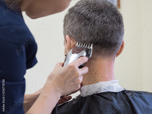 Haircut machine. Man clipping machine in salon. 