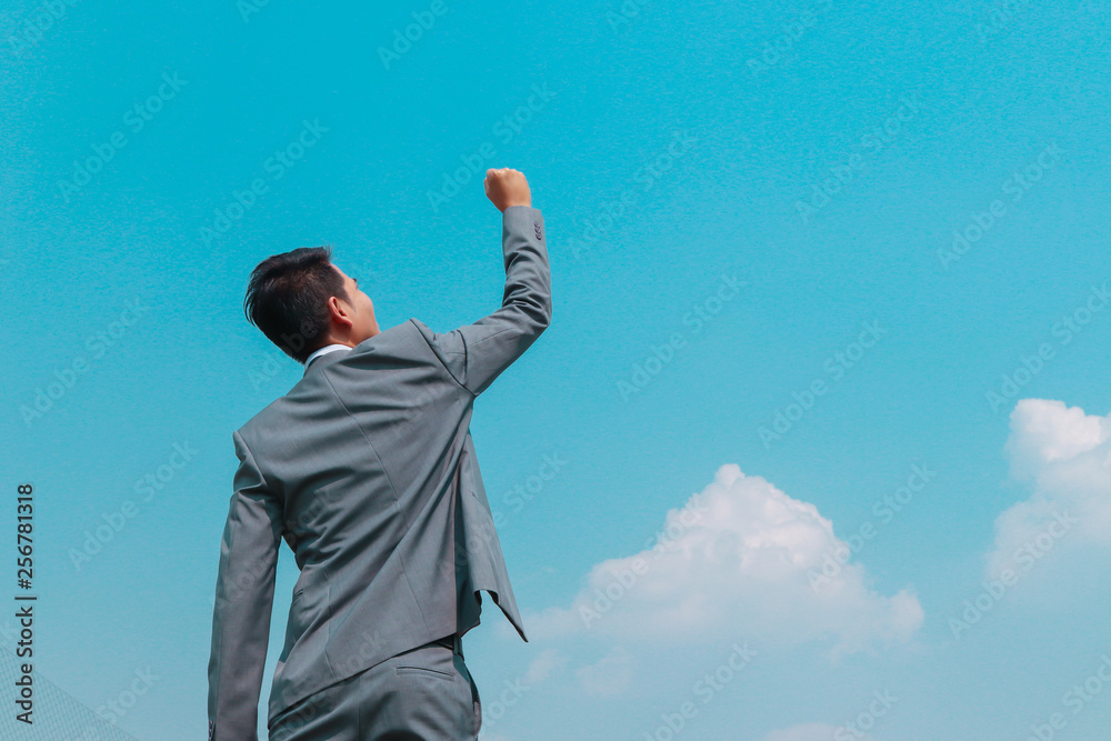 businessman with arms raised sign of success businessman with arms raised sign of success