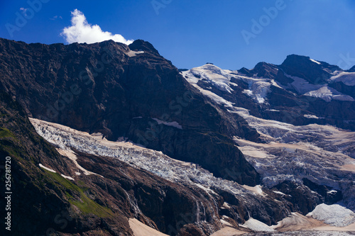 Huge mountain glacier in the surroundings of Dombai. Caucasus Mountains summer, clear day.