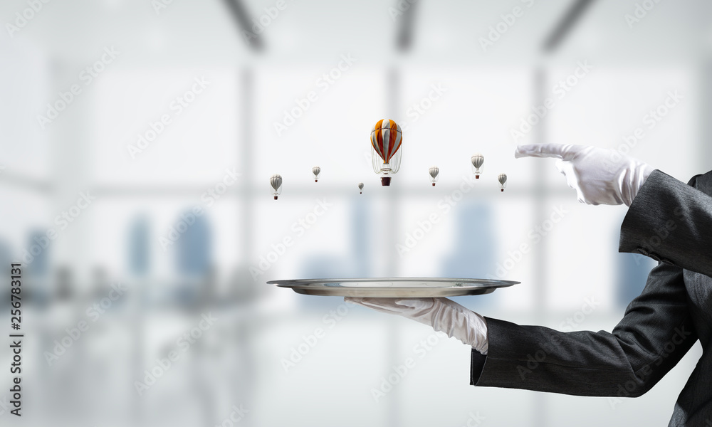 Hand of waiter presenting balloons on tray. Hand of waiter presenting balloons on tray.