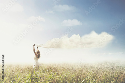 sweet dream of a girl carrying a cloud in the sky