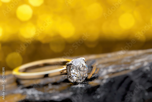 Gold Diamond Ring on The Yellow Bokeh Background