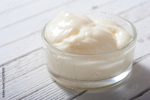 creme fraiche on white wood table background