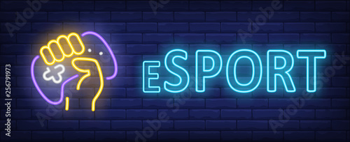 Esport neon text with hand holding gamepad