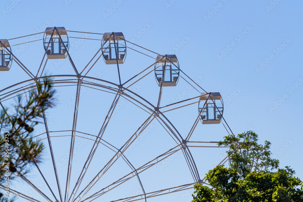 Ferris wheel over blue sky Ferris wheel over blue sky