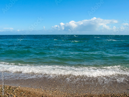 beautiful sea waves with foam in a hot sunny day. summer vacation concept. nobody is here