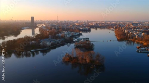 View across the water to the city center of Berlin at dusk photo