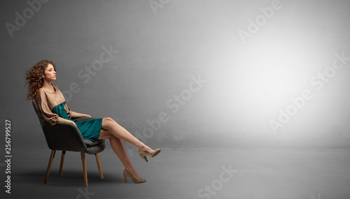 Young beautiful woman modeling in an empty studio 