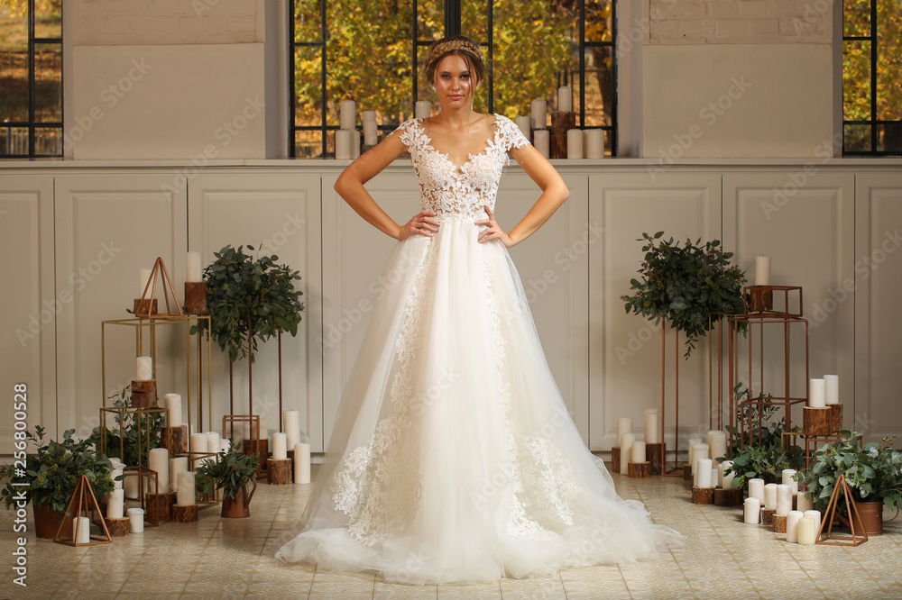 Fototapeta premium Beautiful blonde model posing in luxury wedding dress