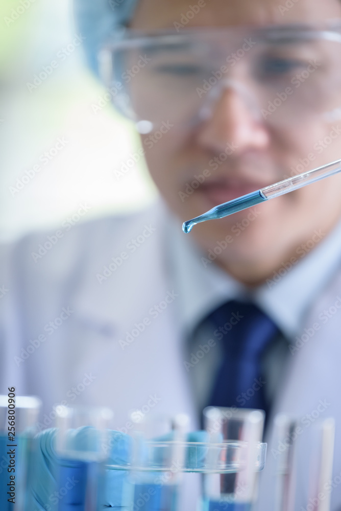 Asian senior scientist male researching and learning in a laboratory. Asian senior scientist male researching and learning in a laboratory.